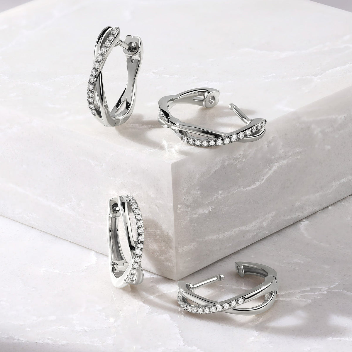 Twisted Radiant Huggie Hoops