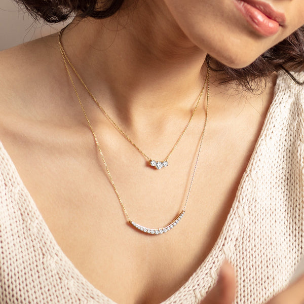 3-Stone-Pendant-Necklace-Product Angle-Lifestyle-Image-verlas-in-yellow-gold-lab-grown-diamond