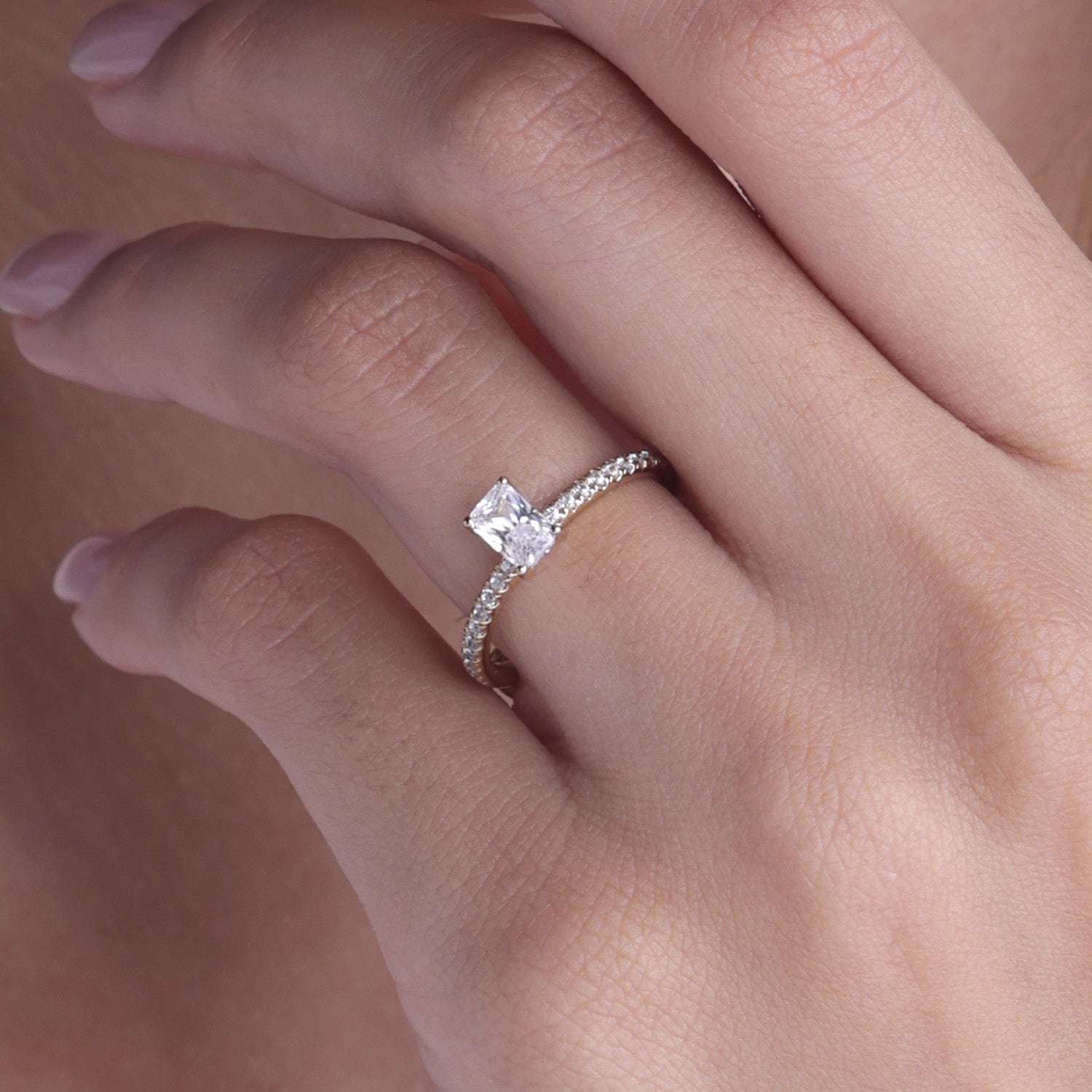 Emerald Four-Prong Solitaire Ring
